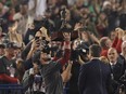 Boston Red Sox's Steve Pearce holds the MVP trophy after Game 5 of baseball's World Series against the Los Angeles Dodgers on Sunday, Oct. 28, 2018, in Los Angeles. The Red Sox won 5-1 to win the series 4 game to 1. (AP Photo/Mark J. Terrill)