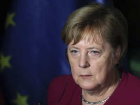 German Chancellor Angela Merkel listens to a question during a press conference after talks with Czech Republic's Prime Minister Andrej Babis in Prague, Friday, Oct. 26, 2018.