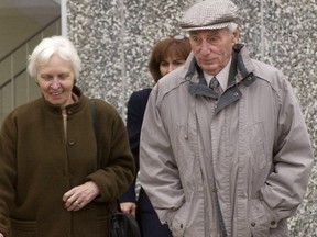 sw / Saturday March 20, 2004 Page A2  Helmut Oberlander (right) and his wife Margret (left) and daughter Irene Rooney (centre behind) leave the courthouse in Kitchener, Ontario on Tue., Nov. 4, 2003. Oberlander, 79, was found by a Federal Court of Canada judge in 2000 to have obtained his citizenship fraudulently by failing to disclose his service with a notorious Nazi killing unit when he came to Canada from Germany in the early 1950s. (CP PHOTO/Waterloo Regional Record-Peter Lee) ORG XMIT: POS2015012216532582 // 0223 na oberlander
