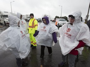 GM workers block the exit from the GM plant on Stevenson St. in Oshawa after hearing the company plans on shutting down the plant on Monday November 26, 2018. Craig Robertson/Toronto Sun