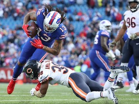 Kelvin Benjamin #13 of the Buffalo Bills is tackled by Adrian Amos Jr. #38 of the Chicago Bears in the fourth quarter during NFL game action at New Era Field on November 4, 2018 in Buffalo, New York.