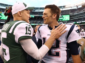 Tom Brady #12 of the New England Patriots shakes hands with Josh McCown #15 of the New York Jets after his team's 27-13 win at MetLife Stadium on November 25, 2018 in East Rutherford, New Jersey. (Photo by Al Bello/Getty Images)