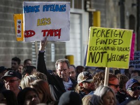 Protesters outside an event Prime Minister Justin Trudeau is attending in Calgary, Nov. 22, 2018.