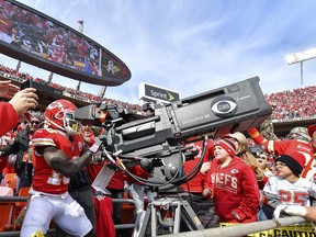 Kansas City Chiefs wide receiver Tyreek Hill takes control of the end zone television camera after scoring a touchdown on Sunday against Arizona. (AP PHOTO)
