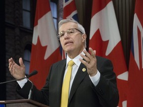 Finance Minister Vic Fedeli addresses the media after delivering his economic statement in the legislature in November 2018. (Stan Behal, Toronto Sun)