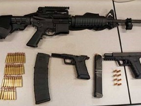 An assault rifle, two handguns and hundreds of rounds of ammunition were seized from an Ajax home on Monday, Sept. 10, 2018 (Durham Regional Police handout)