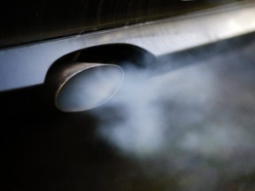 A file photo shows exhaust gases coming from a car, (AFP photo)