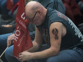 Carl Dillmam, who has worked at the General Motors plant for 37 years sits with union members in Oshawa, Ontario, on Nov. 26, 2018. (Getty Images)