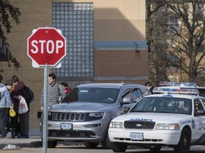 Toronto Police officers respond to a bomb threat at St. Michael's College School, in Toronto on  Nov. 19, 2018. (The Canadian Press)