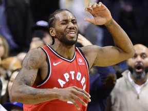 Raptors forward Kawhi Leonard reacts after knocking the ball out of bounds with two seconds left in a tie game against the Detroit Pistons on Wednesday night. (THE CANADIAN PRESS)