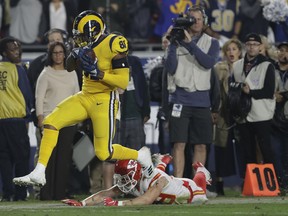 Los Angeles Rams tight end Gerald Everett breaks away from Kansas City Chiefs defensive back Daniel Sorensen during Monday's game. (AP PHOTO)