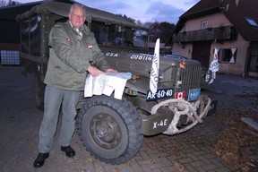 Liberation Tours guide Albert âBertâ Eikelenboom with maps of key Second WorldâWar battle sites in the Netherlands, on fender of his 1944 U.S. Army weapons carrier truck. (Photo by Ian Robertson)