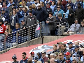 A hole is left in the tarp that covers the Tennessee Titans player entrance to the field as fans watch the Titans play the New England Patriots in the second half of an NFL football game in Nissan Stadium, Sunday, Nov. 11, 2018, in Nashville, Tenn. (AP Photo/Mark Zaleski)