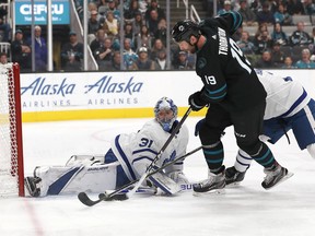 Leafs goaltender Frederik Andersen makes a save against Sharks centre Joe Thornton when the two teams met in San Jose earlier this month. (AP PHOTO)