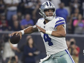 In this Oct. 7, 2018, file photo, Dallas Cowboys quarterback Dak Prescott (4) throws against the Houston Texans during the first half of an NFL football game in Houston. (AP Photo/Eric Christian Smith, File)