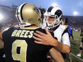 Jared Goff #16 of the Los Angeles Rams shakes hands with  Drew Brees #9 of the New Orleans Saints after a game at Los Angeles Memorial Coliseum on November 26, 2017 in Los Angeles, California.