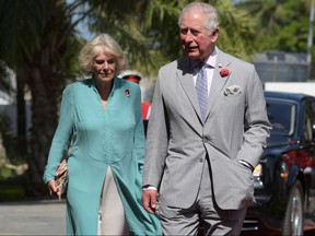 Prince Charles, the Prince of Wales, and Camilla, the Duchess of Cornwall, arrive in Banjul during an official visit in Gambia, on Nov. 1, 2018. (SEYLLOU/AFP/Getty Images)