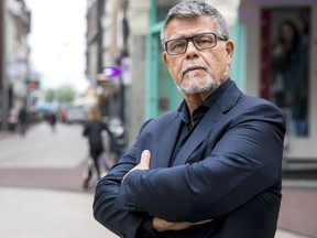 This photo taken on November 5, 2018 shows s portrait of a 69 year old Dutchman Emile Ratelband in the centre of Arnhem, The Netherlands. - Emile Ratelband wants his official age (69) to be adjusted with his 'emotional age' (49).