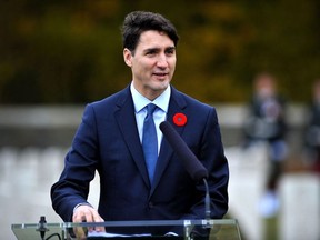 Canada's Prime minister Justin Trudeau (C) delivers a speech during a ceremony in tribute to Canadian soldiers killed during the First World War at the Canadian National Vimy Memorial, on November 10, 2018 in Vimy, on the eve of commemorations marking the 100th anniversary of the 11 November 1918 armistice, ending World War I.