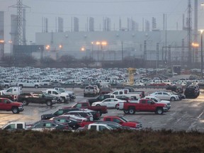 Hundreds of General Motor vehicles are parked outside the GM Assembly plant in Oshawa, Ont., on Nov. 26, 2018.