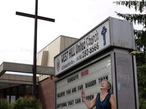 Rev. Gretta Vosper is seen at her West Hill United Church, in Toronto in an Aug. 5, 2015, file photo. A United Church committee is recommending that the avowed atheist minister in Toronto be defrocked.