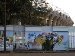 Paintings depicting NFL players and logos from previous years cover a wall surrounding Azteca Stadium in Mexico City, Tuesday, Nov. 13, 2018. The NFL has moved the  Monday night showdown featuring the Rams and Chiefs from Mexico City to Los Angeles due to the poor condition of the field at Azteca Stadium.