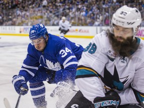 Maple Leafs’ Auston Matthews (left) puts on the brakes as he closes in on San Jose Sharks’ Brent Burns during Wednesday night’s game at Scotiabank Arena. (Ernest Doroszuk/Toronto Sun)