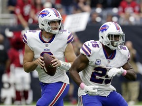 In this Sunday, Oct. 14, 2018, file photo ,Buffalo Bills quarterback Nathan Peterman (2) drops back to pass during the second half of an NFL football game the Houston Texans in Houston.