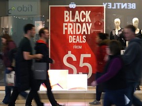 Shoppers stroll during the Black Friday sale at Polo Park Shopping Centre in Winnipeg on Nov. 25, 2016.