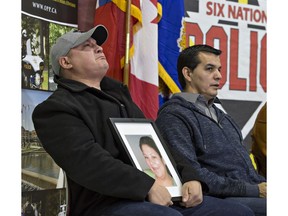 An emotional Trevor Miller holds a portrait of his sister, Melissa Miller during a news conference on the Six Nations of the Grand River Territory on Thursday November 15, 2018. Melissa Miller was one of three Six Nations residents found slain in the Municipality of Middlesex Centre, near London, earlier this month. Brian Thompson/Brantford Expositor/Postmedia Network