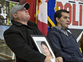 An emotional Trevor Miller holds a portrait of his sister Melissa Miller during a news conference on the Six Nations of the Grand River Territory on November 15, 2018. Melissa Miller was one of three Six Nations residents found murdered found in the Municipality of Middlesex Centre, near London, Ont. earlier this month. Brian Thompson/Postmedia Network