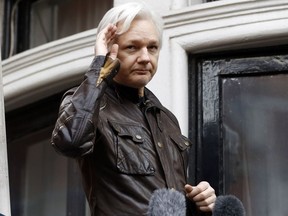 In this May 19, 2017, file photo, WikiLeaks founder Julian Assange greets supporters from a balcony of the Ecuadorian embassy in London.