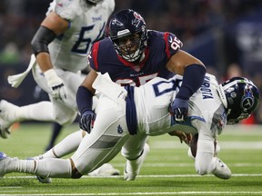 Christian Covington (95) of the Texans sacks Titans quarterback Marcus Mariota during in second quarter NFL action at NRG Stadium in Houston on Monday, Nov. 26, 2018.