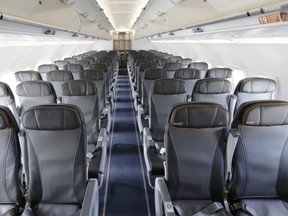 This March 16, 2017, file photo shows the interior of a commercial airliner at John F. Kennedy International Airport in New York.  (AP Photo/Seth Wenig)