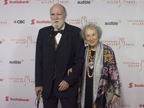 Margaret Atwood and Graeme Gibson stop on the red carpet at the Scotiabank Giller Bank Prize gala in Toronto on November 19, 2018. Canadian literary great Margaret Atwood is writing a sequel to her internationally renowned dystopian novel "The Handmaid's Tale." Publisher McClelland and Stewart says it will publish "The Testaments" on Sept. 10, 2019.