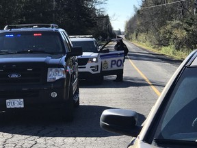 Police have closed a section of McGee Side Road between the 417 and William Mooney Road after a mid-air collision between two plane (Ashley Fraser/Postmedia Network)