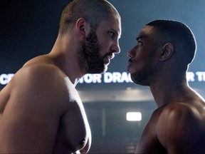This image released by Metro Goldwyn Mayer Pictures / Warner Bros. Pictures shows Florian Munteanu, left, and Michael B. Jordan in a scene from "Creed II." (Barry Wetcher/Metro Goldwyn Mayer Pictures/Warner Bros. Pictures via AP)