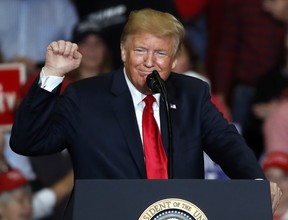President Donald Trump pumps his fist as he speaks during a campaign rally Monday, Nov. 5, 2018, in Cape Girardeau, Mo. (Jeff Roberson/AP)