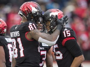 Calgary Stampeders' Eric Rogers, right, celebrates his touchdown with teammates during first half CFL West Final football action against the Winnipeg Blue Bombers in Calgary, Sunday, Nov. 18, 2018. (THE CANADIAN PRESS/Todd Korol)