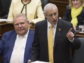 Vic Fedeli rises in the legislature at Queen's Park to read the Economic Outlook For Ontario, November 15, 2018. (Stan Behal/Toronto Sun/Postmedia Network)