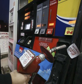 File photo of a motorist filling up at a gas station on Kingston Rd. (Veronica Henri/Toronto Sun/Postmedia Network)