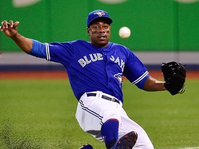 In this July 22 2018, file photo, Toronto Blue Jays right fielder Curtis Granderson a foul ball during the fourth inning against the Baltimore Orioles in a baseball game in Toronto.