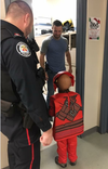 Toronto Police officers and civilians working at 31 Division in North York ensured a young boy didn’t miss out on Halloween by taking him trick-or-treating around the police station on Wednesday, Oct. 31, 2018. (Facebook)