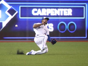 The Blue Jays' Teoscar Hernandez misplays a ball against the Minnesota Twins this past season. (Tom Szczerbowski/Getty Images)