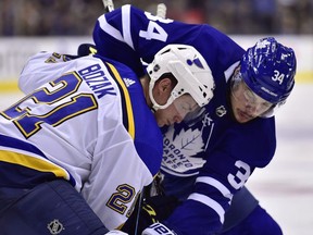 St. Louis Blues centre Tyler Bozak (21) and Toronto Maple Leafs centre Auston Matthews (34) battle for the puck at faceoff during third period NHL action in Toronto on October 20, 2018.