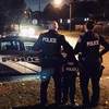 Toronto Police Consts. Glen Espie and Sara da Silva, of 43 Division, recently partnered up with this little boy in Scarborough. (Twitter)