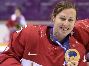 Jayna Hefford shows off the gold medal she won with Team Canada at the Sochi Games in 2014. THE CANADIAN PRESS