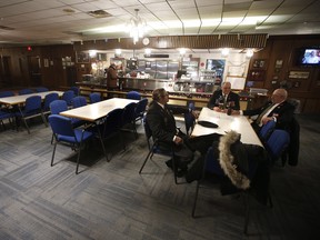 Veterans, from left, Bernard Roy, 37 years service, Mike Fehr, 33 years service and Darcy Halladay, 34 years service, chat at The Royal Canadian Legion, St James Branch No. 4 in Winnipeg, Manitoba Thursday, Nov. 8, 2018.