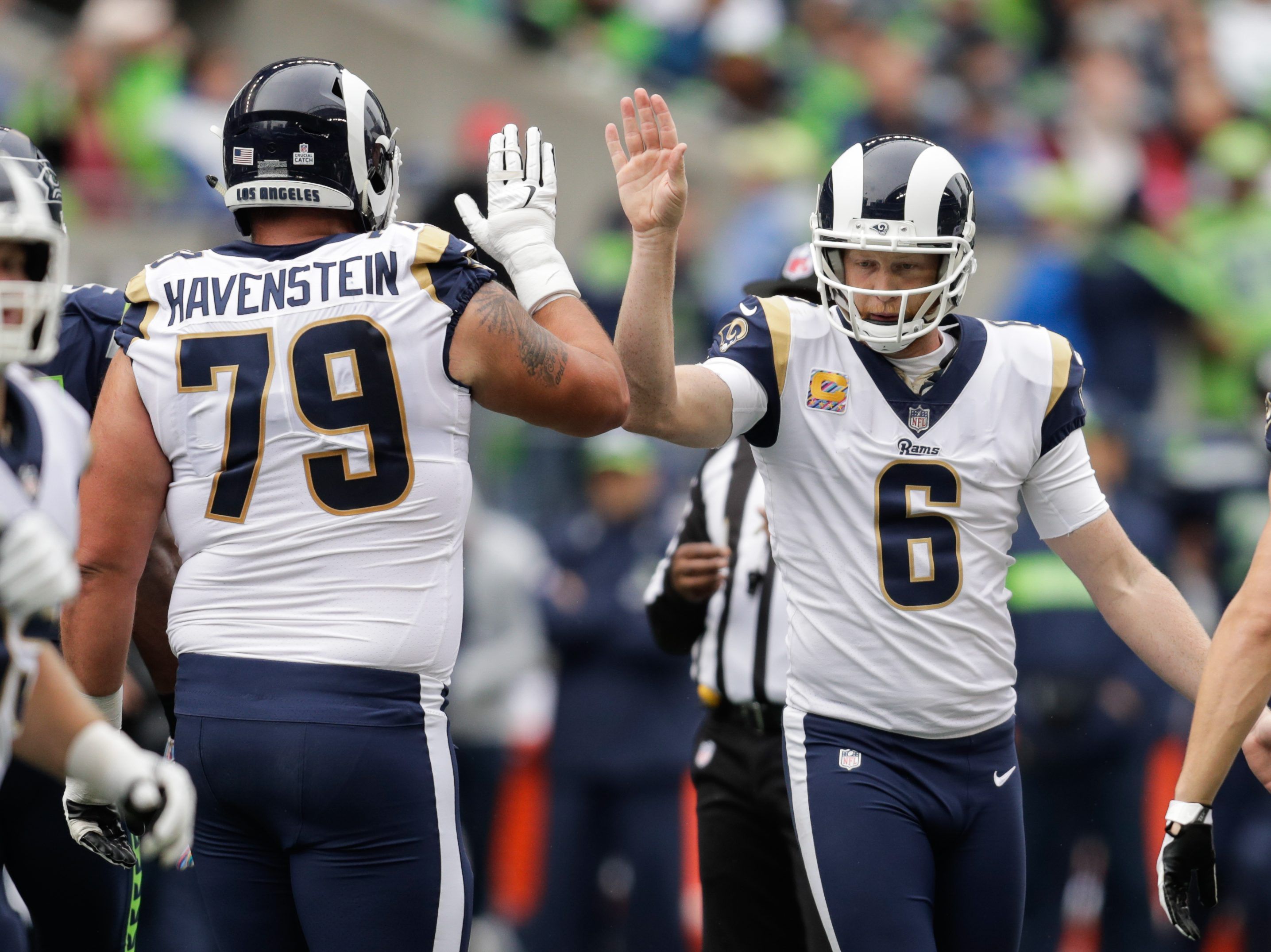 Punter Johnny Hekker of the Los Angeles Rams throws the football