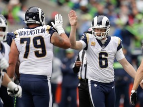 Punter Johnny Hekker, right, of the Los Angeles Rams celebrates with Tackle Rob Havenstein after a punt in the second against the Seattle Seahawks at CenturyLink Field on Oct. 7, 2018 in Seattle, Wash. (Stephen Brashear/Getty Images)